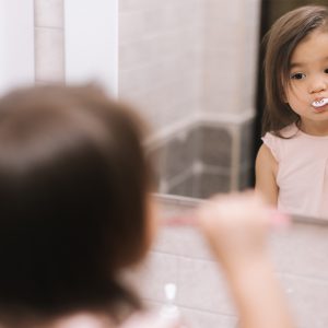 At What Age Should a Child be Able to Brush on Their Own? Portrait